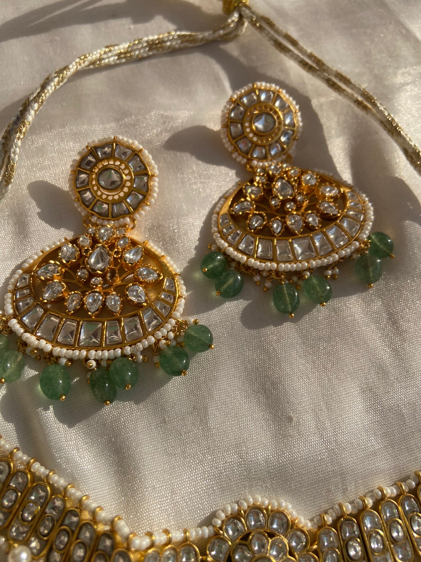 Hindu jewelry design, carrying forward the values of culture, devotion, and timeless fashion. Whether worn during festivals, spiritual rituals, or family celebrations, this necklace offers unmatched elegance and meaningful connection to our roots.This handcrafted Polki necklace set is a breathtaking example of traditional Indian jewelry, made in 925 sterling silver and adorned with luxurious 22k gold plating. Inspired by the royal heritage of Jaipur, Rajasthan, this necklace showcases the timeless beauty