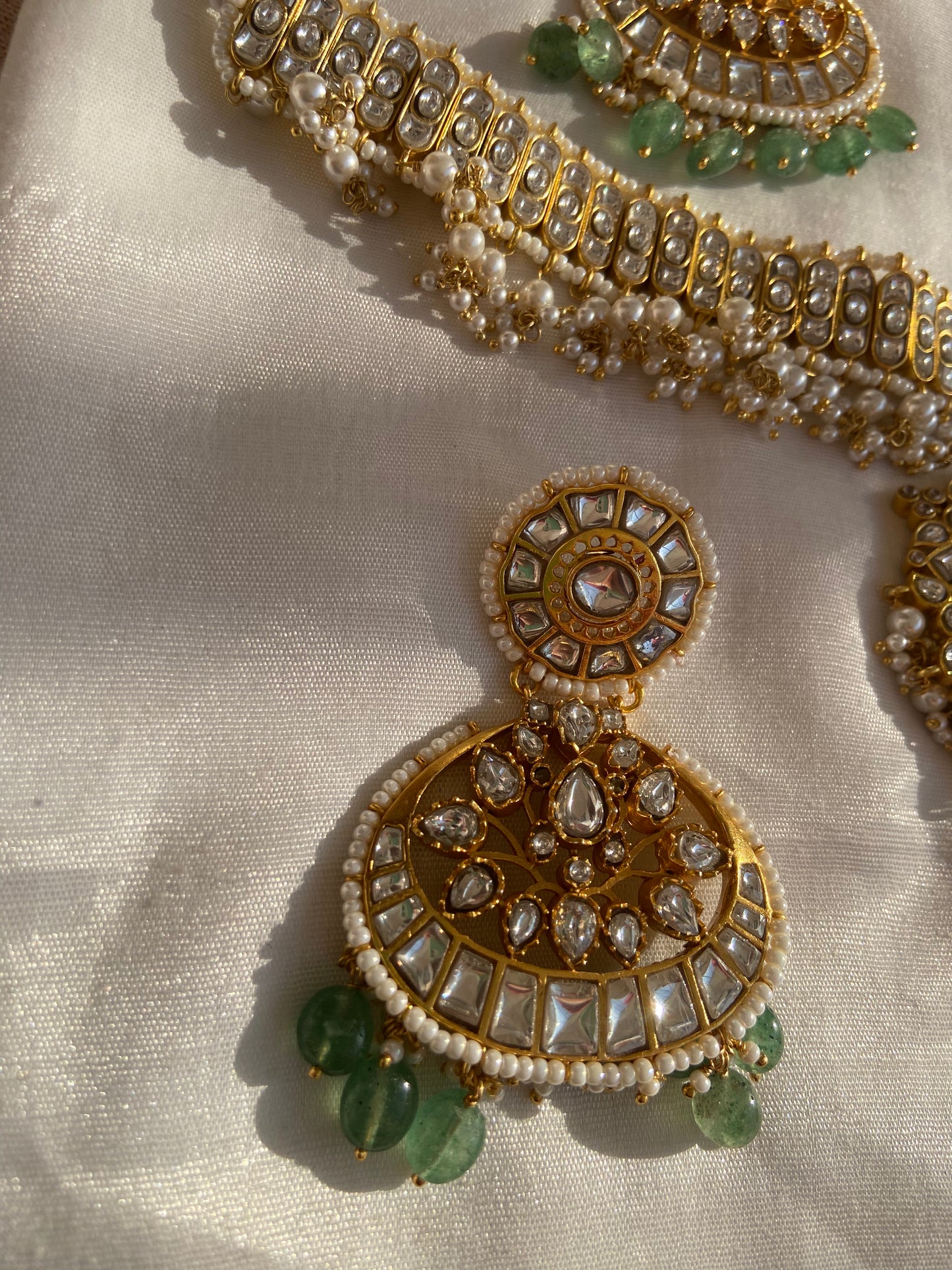 No two pieces are exactly alike, making this more than just jewelry—it is wearable art. The thoughtful packaging also makes it an elegant gift, ready to delight and leave a lasting impression.
This Kundan Meena Polki necklace with pearls, emerald beads, silver base, and gold plating is not just an accessory; it is a celebration of heritage, a symbol of feminine strength, and a reminder of our eternal cultural roots in Sanatan Dharma. From sacred occasions to festive celebrations, it empowers every woman to