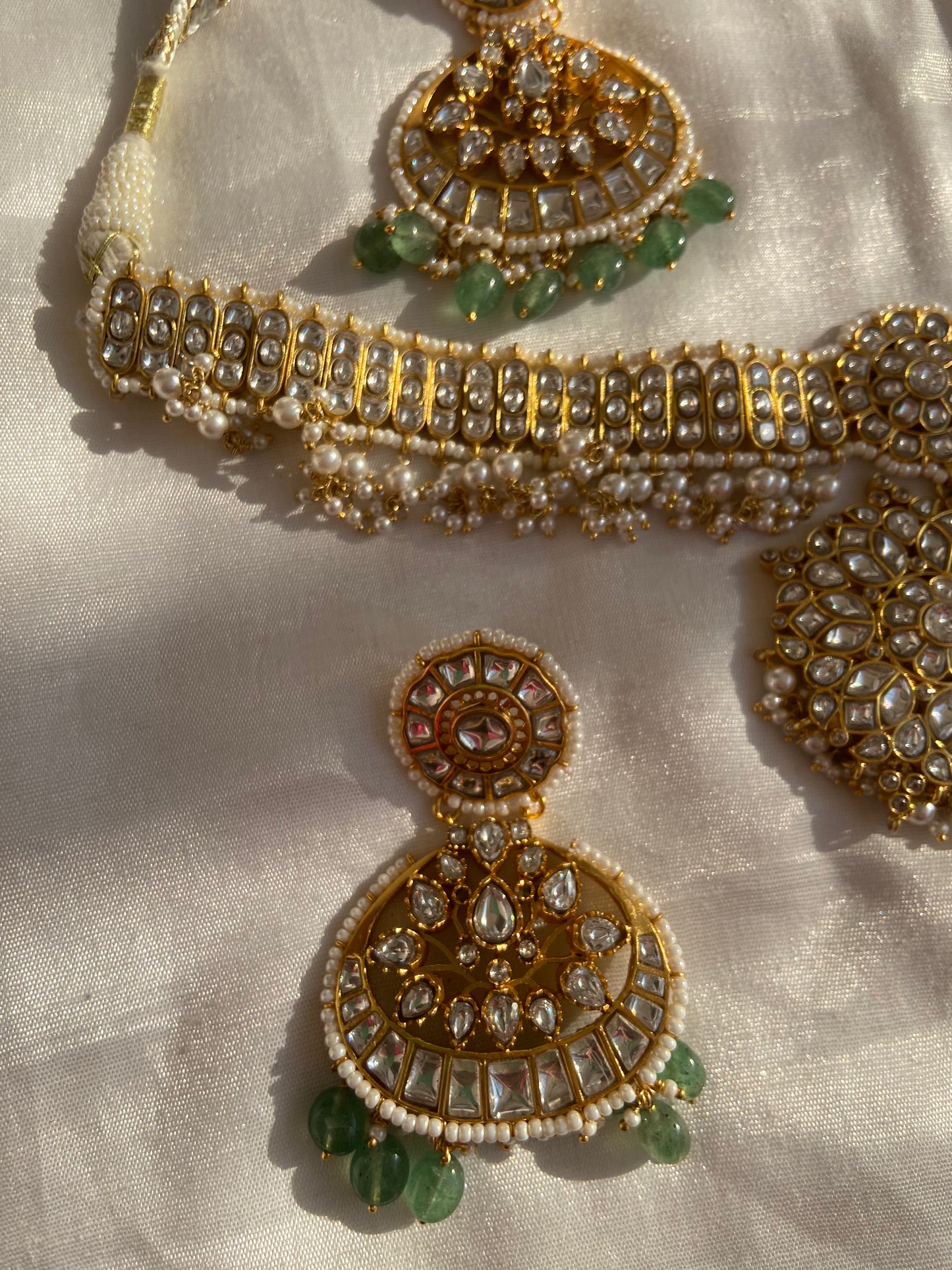 Meenakari work, or minakari, is not only decorative but also carries spiritual significance, representing balance, beauty, and divine connection. Every curve and setting in this necklace is a tribute to Indian jewelry traditions that honor both the inner and outer beauty of a woman.
Wearing this Polki necklace with pearls and emeralds is an experience in itself. It uplifts the entire appearance with elegance, power, and traditional charm. Pair it with a Kanjeevaram saree, Banarasi silk, or a heavy embroide
