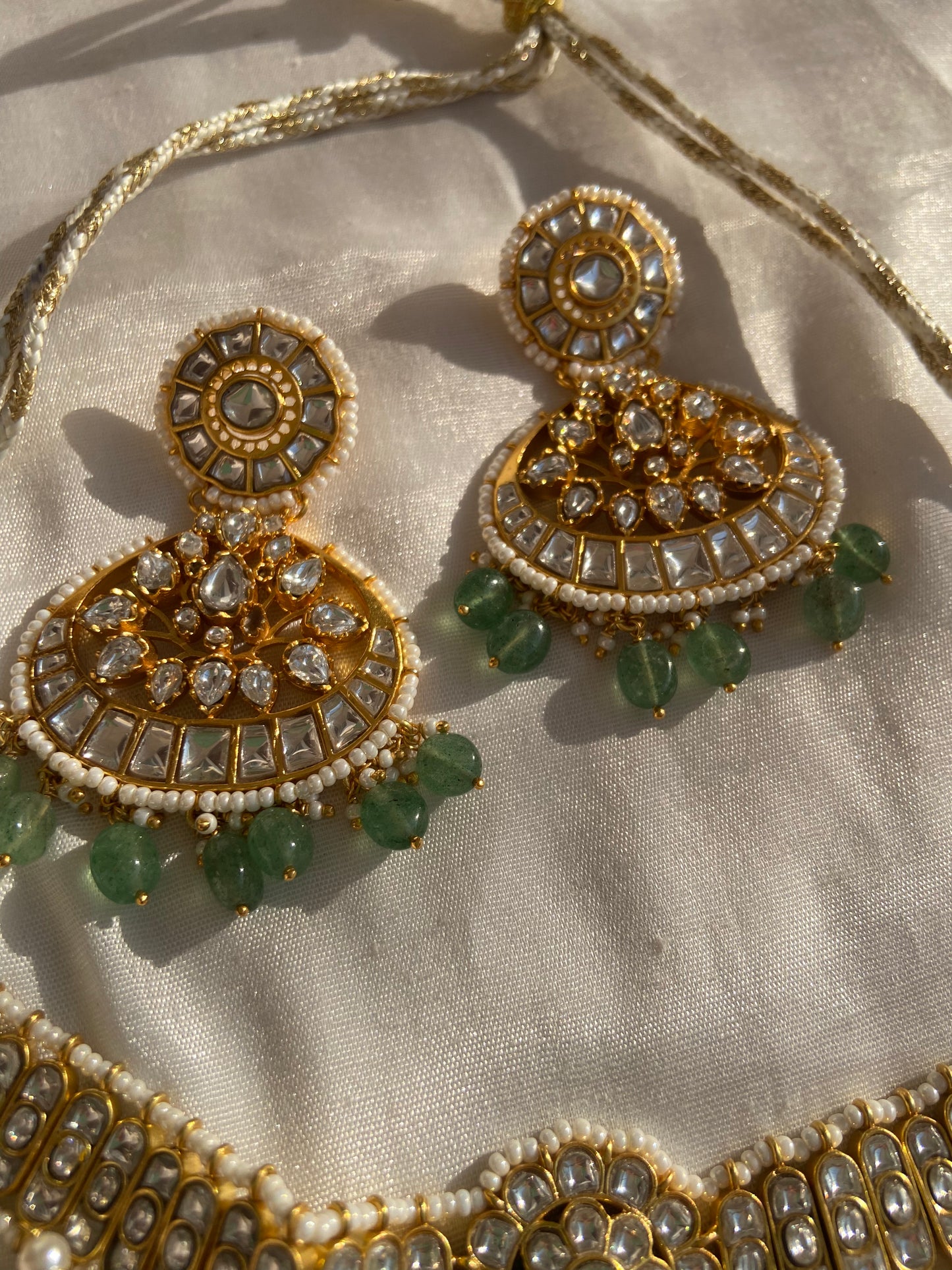 In Sanatan Dharma, jewelry is a sacred offering that represents protection, blessings, and abundance. When you gift a Kundan Meena necklace made in silver with gold plating, embedded with Polki stones, emerald beads, and pearl accents, you're gifting both luxury and cultural legacy. It becomes a cherished keepsake for life—an investment in both beauty and value. Whether it’s for a bride, a daughter, a mother, or a close friend, this necklace will hold emotional and spiritual value for generations.