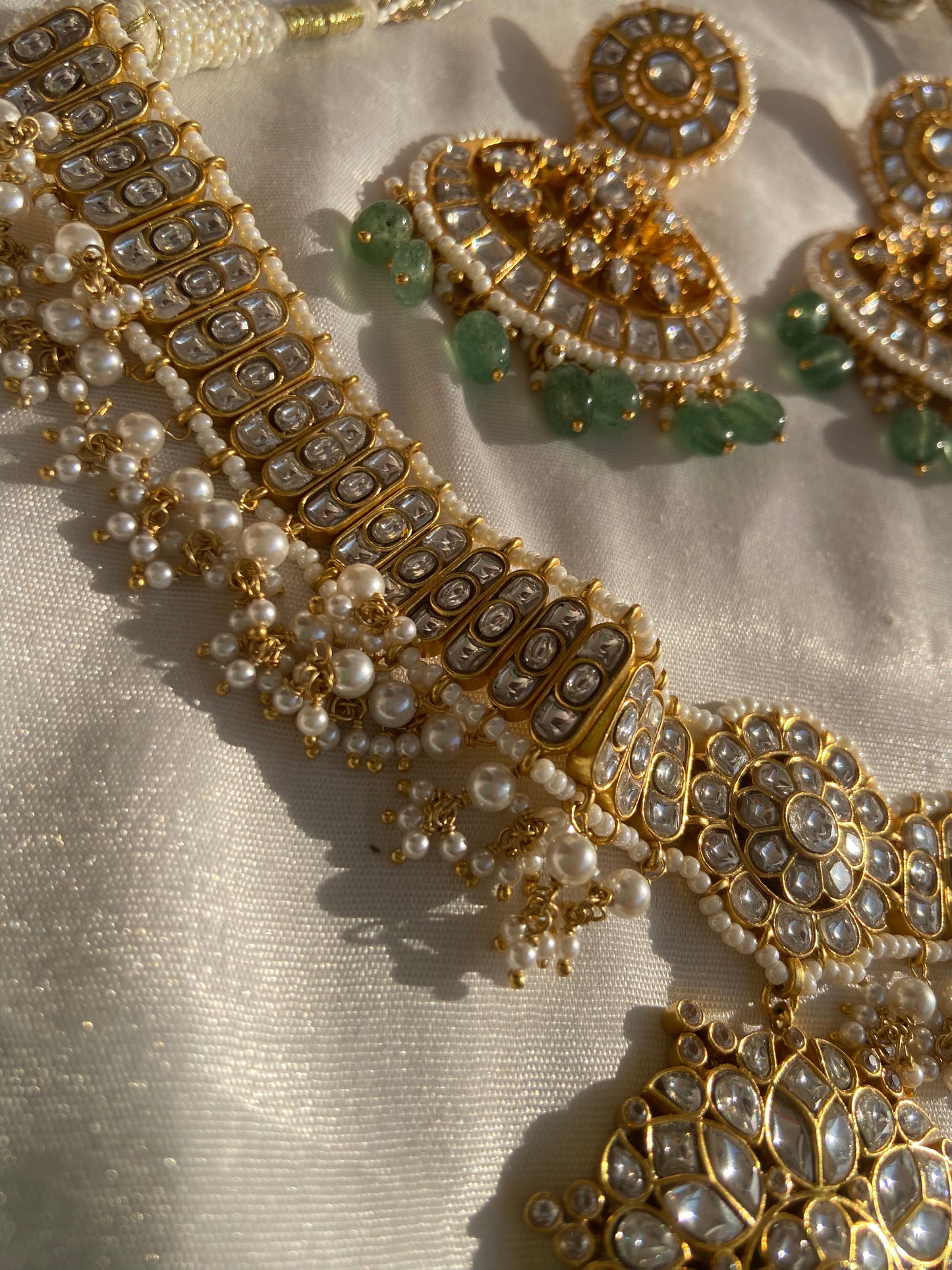 ilver jewelry, especially when gold plated and embedded with stones like Polki and emerald, is one of the wisest investments in sustainable luxury. Silver has healing properties and remains durable over time, while 22k gold plating adds richness without compromising affordability. The value of handcrafted jewelry like this Polki necklace only increases over time. The unique combination of silver, gold plating, emeralds, and pearl beads ensures a high-value purchase that also supports traditional Indian arti