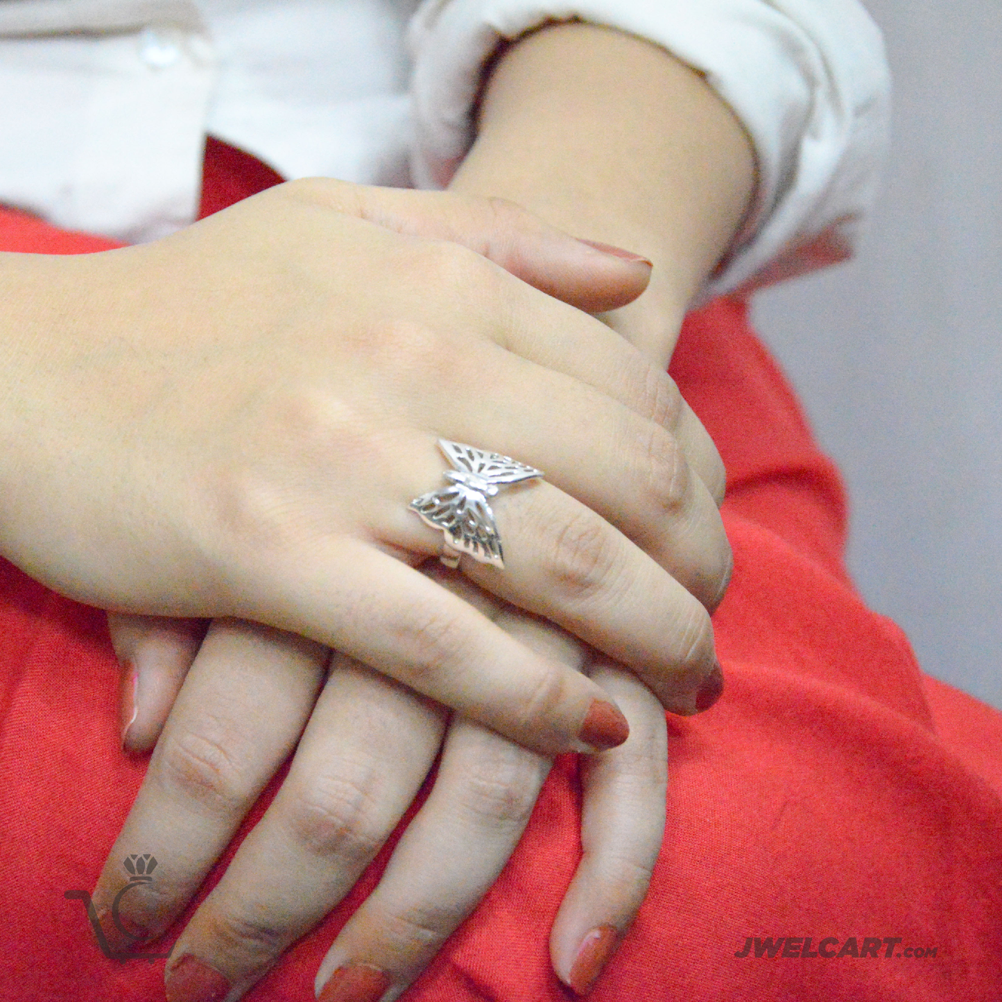 women wearing butterfly ring