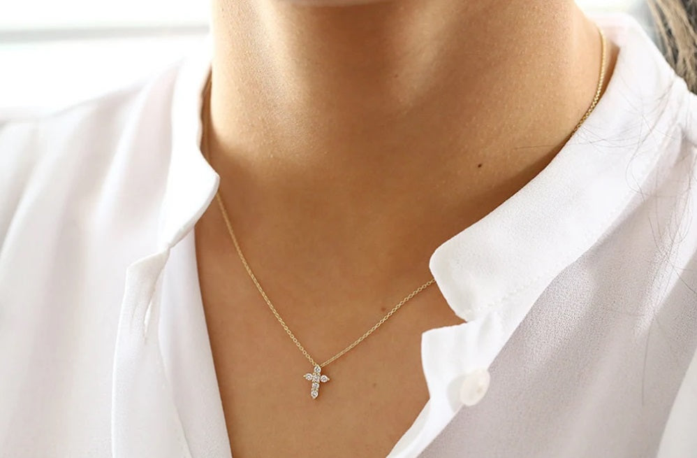 WOMEN WEARING CROSS PENDANT