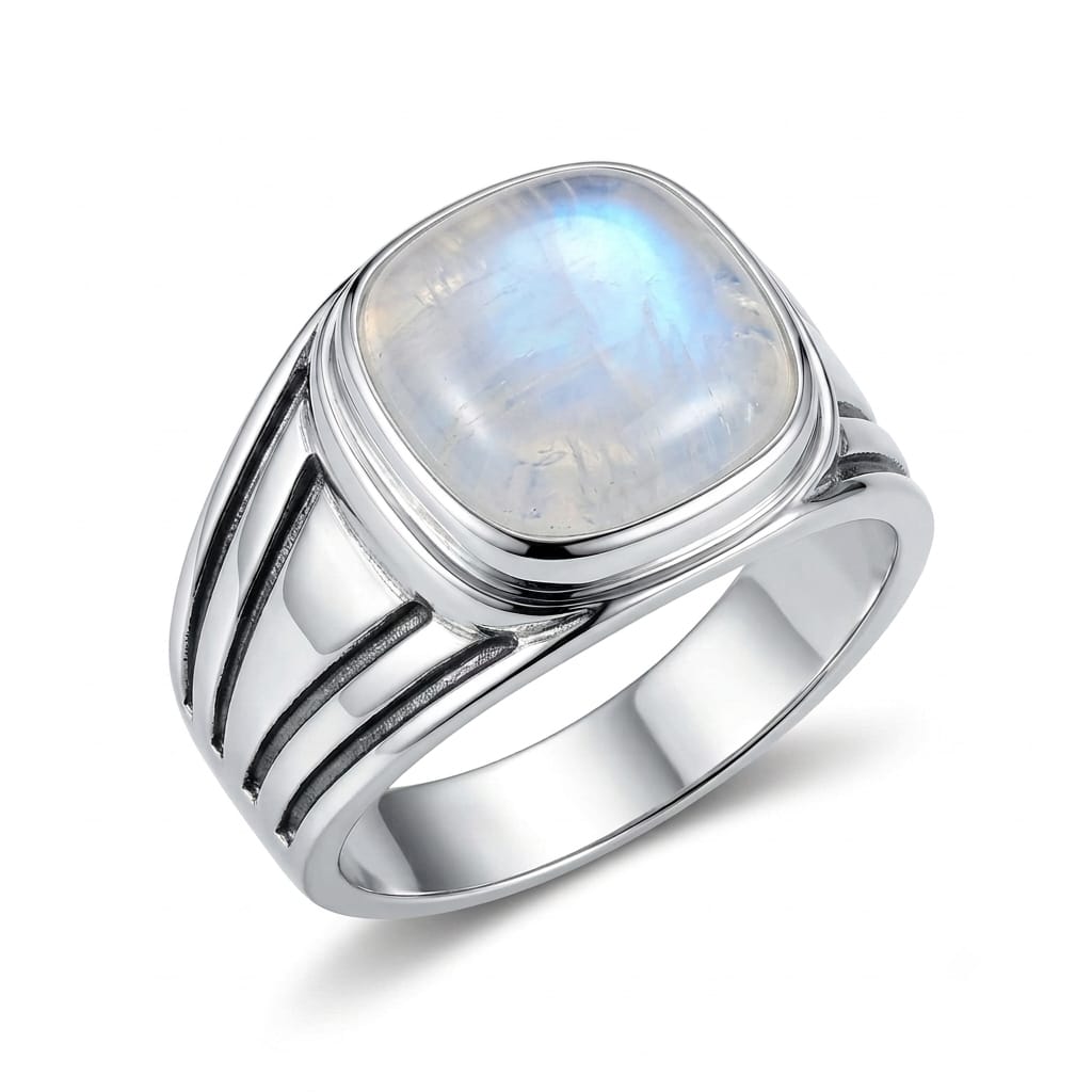 Make a bold impression with this Men's Rainbow Moonstone Ring, handcrafted in genuine 925 Sterling Silver for men who appreciate distinctive gemstone jewelry and powerful statement designs. Featuring a natural Rainbow Moonstone centerpiece with its beautiful shifting flashes of color, this handmade men's ring combines traditional artisan craftsmanship with a bold hip hop inspired aesthetic.