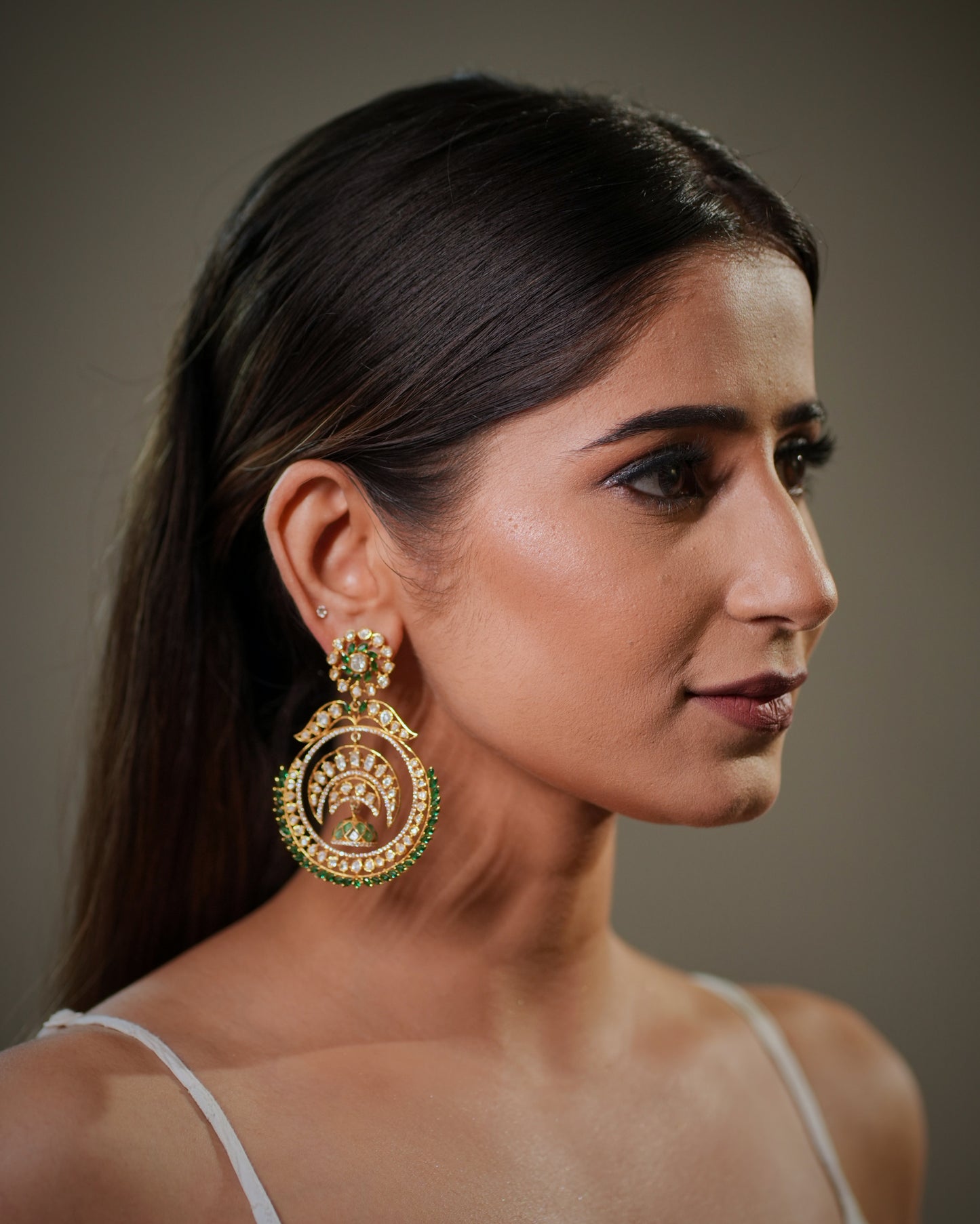 Fine handcrafted Indian earrings with heritage craftsmanship, combining modern luxury with timeless ethnic elegance. Heavy bridal statement earrings with intricate artisan detailing, suitable for luxury wedding collections, festive styling and couture bridal fashion.

Designer Moissanite Chandbali earrings with handcrafted gemstone work, premium wedding jewelry for women looking for elegant traditional accessories. Indian bridal earrings in sterling silver with hallmarked quality, luxury Polki jewelry inspi