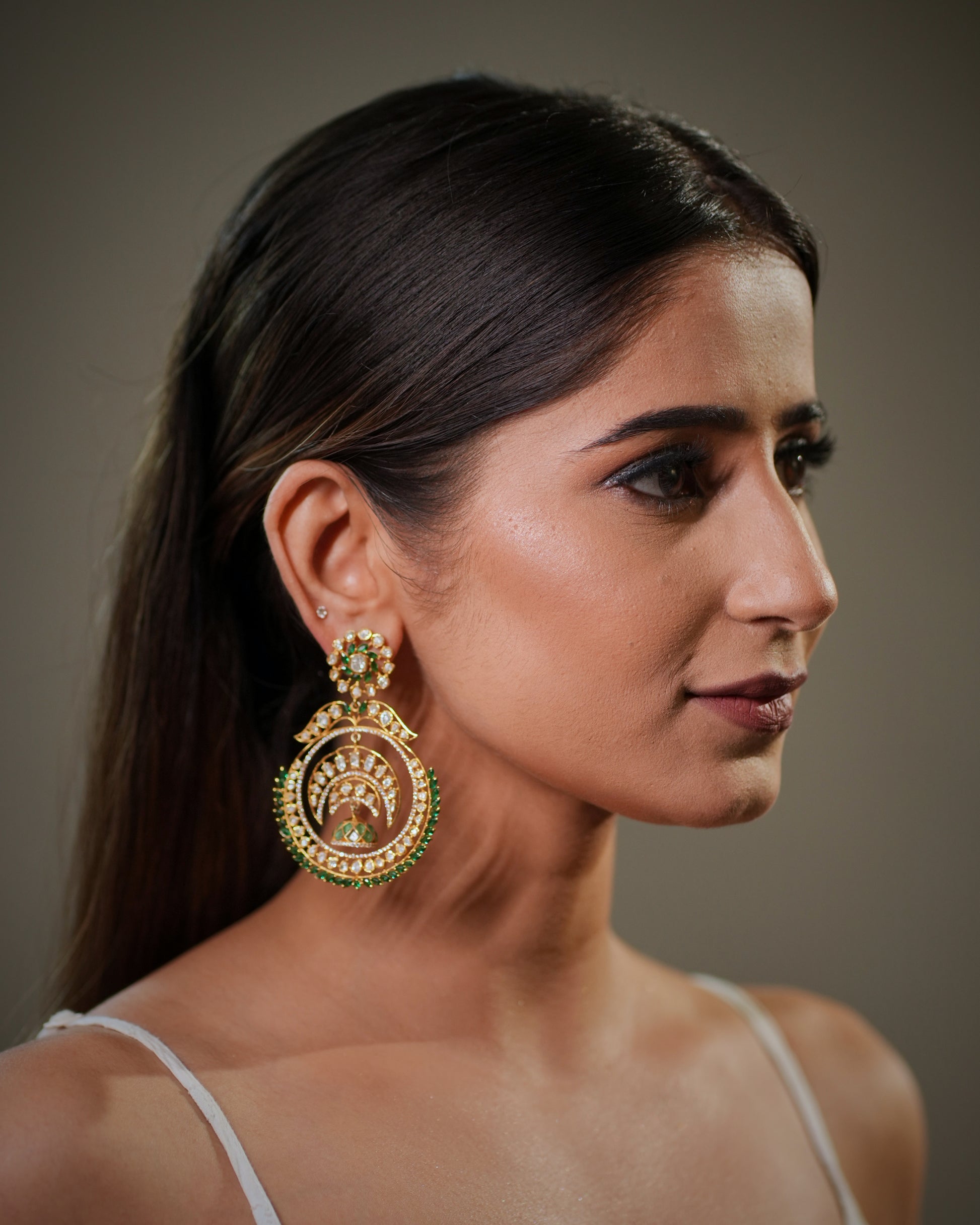 Fine handcrafted Indian earrings with heritage craftsmanship, combining modern luxury with timeless ethnic elegance. Heavy bridal statement earrings with intricate artisan detailing, suitable for luxury wedding collections, festive styling and couture bridal fashion.

Designer Moissanite Chandbali earrings with handcrafted gemstone work, premium wedding jewelry for women looking for elegant traditional accessories. Indian bridal earrings in sterling silver with hallmarked quality, luxury Polki jewelry inspi
