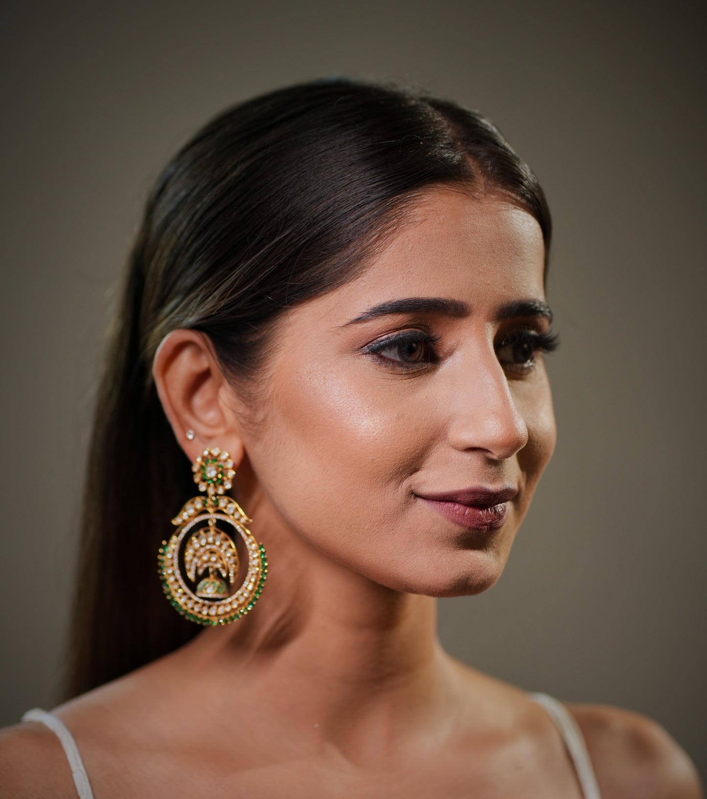 Handcrafted Jaipur India Chandbali earrings made with intricate Polki craftsmanship, sparkling Moissanite stones and rich emerald detailing inspired by royal Indian bridal jewelry traditions.

Luxury bridal earrings manufactured in Jaipur India using 925 sterling silver, premium 22K gold plating and traditional handmade artisan techniques for timeless ethnic elegance.

Designer Indian wedding earrings from Jaipur India featuring heritage Mughal inspired craftsmanship, handcrafted gemstone setting and statem