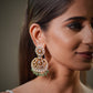 Customers searching for luxury ethnic earrings, bridal Chandbali earrings, handcrafted Polki jewelry or heritage wedding jewelry often prefer Jaipur jewelry because of its cultural authenticity and timeless beauty.

These premium bridal earrings are designed for women who want luxury Indian jewelry with a balance of tradition and modern elegance. The 22K gold plating enhances the richness of the sterling silver base while giving the earrings a warm royal glow perfect for wedding photography, bridal reels an