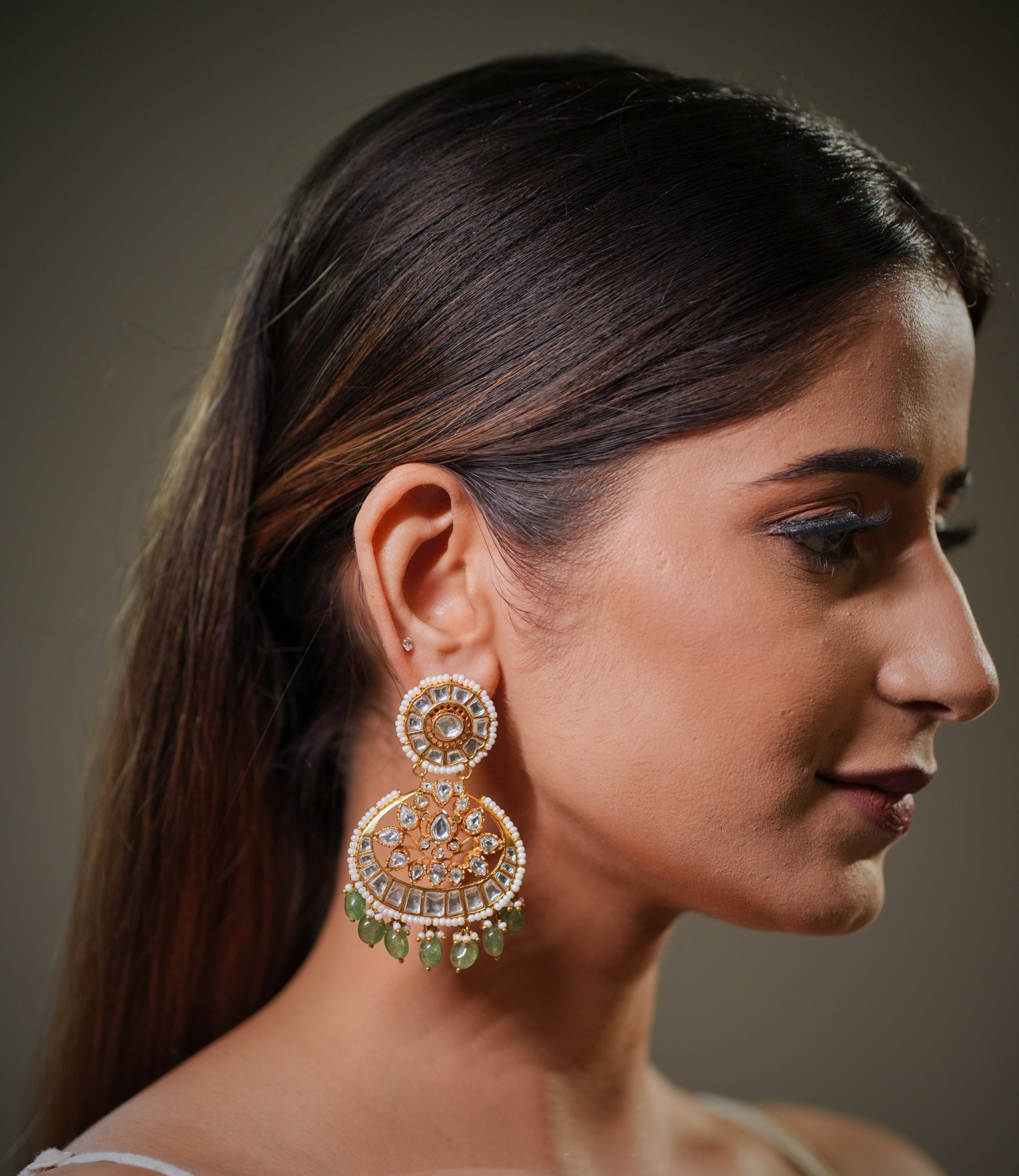 Gold plated silver jewelry is becoming increasingly popular among brides because it offers premium luxury aesthetics while maintaining affordability compared to solid gold jewelry. Women today prefer investment worthy bridal jewelry that can be styled repeatedly with different ethnic outfits, and sterling silver Polki earrings perfectly fit this demand.

Handcrafted emerald pearl earrings are also highly searched for destination weddings, festive events and luxury ethnic styling because they look elegant bo