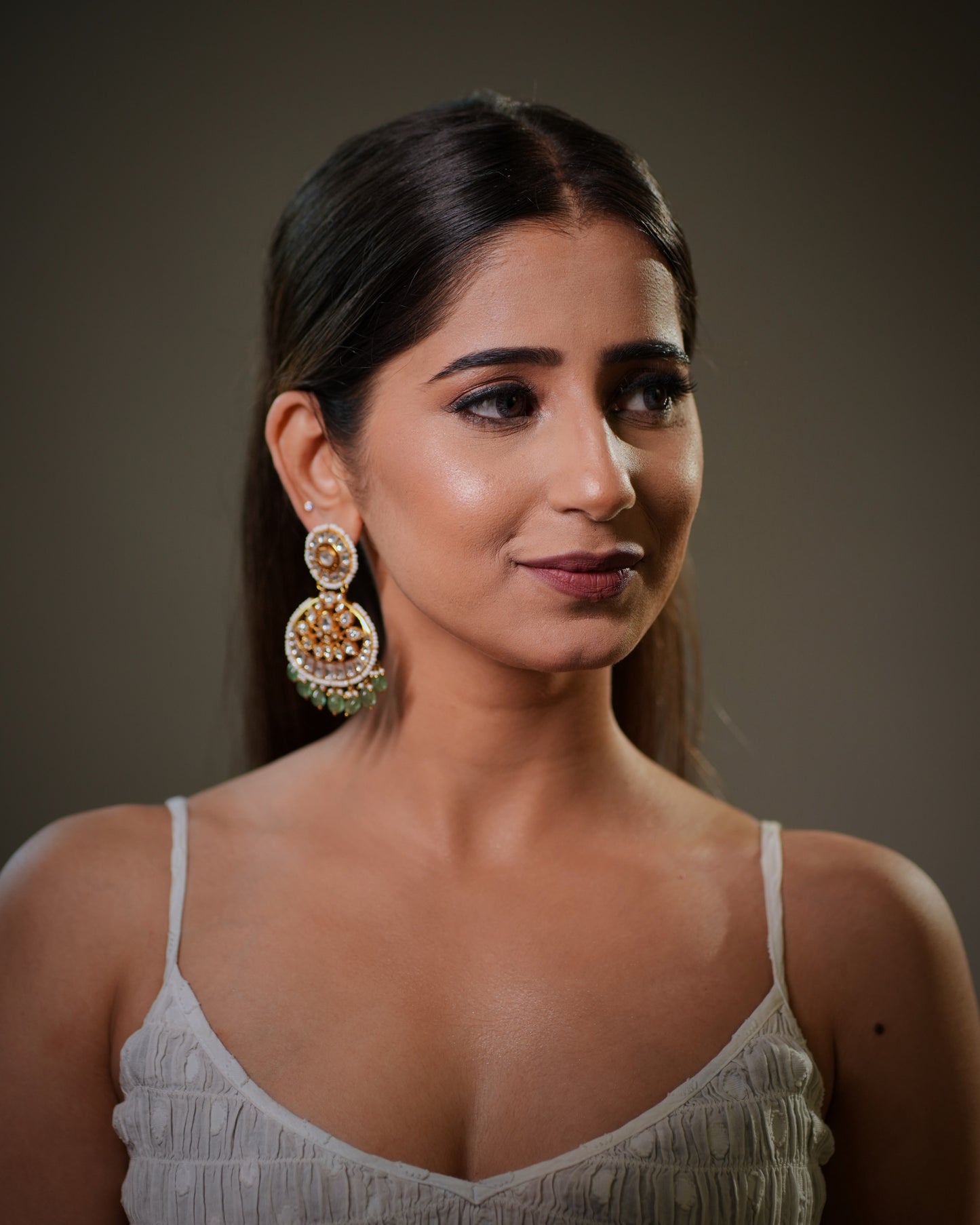 craftsmanship and metal worth, making it one of the most searched jewelry categories online. Gold plated sterling silver earrings provide the rich appearance of fine gold jewelry while remaining more affordable and wearable for modern women who love luxury ethnic fashion.

These emerald Polki earrings are ideal for Indian brides looking for royal wedding jewelry inspired by Mughal, Rajasthani and heritage Indian jewelry traditions.