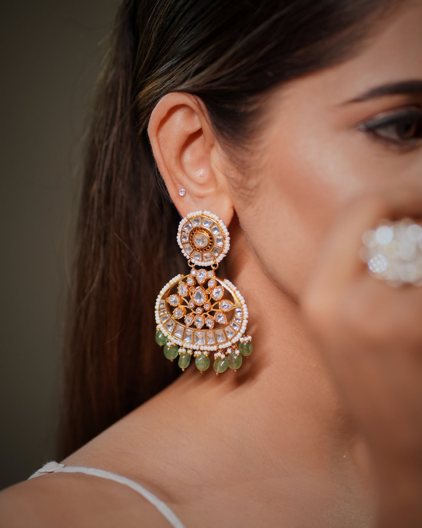 The handcrafted detailing, premium gemstone setting and elegant pearl work create a timeless bridal aesthetic that pairs beautifully with lehenga, saree, Anarkali, Indo western outfits and couture bridal wear. Chandbali earrings remain one of the most trending bridal jewelry styles in India because they enhance facial features, create a grand festive appearance and complete traditional wedding looks effortlessly. Brides searching for statement earrings for wedding,reception, sangeet, mehendi or engagement 