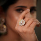 This luxurious Moissanite Polki Ring in 925 Sterling Silver with 22k Gold Plated finish is a perfect blend of royal Indian craftsmanship and modern elegance. Designed with sparkling polki stones and premium moissanite detailing, this adjustable cocktail ring adds timeless beauty to every bridal, festive, and party look. Inspired by traditional Jaipur jewellery artistry, this handcrafted statement ring reflects the grandeur of royal heritage jewellery while offering the comfort of contemporary fashion jewell