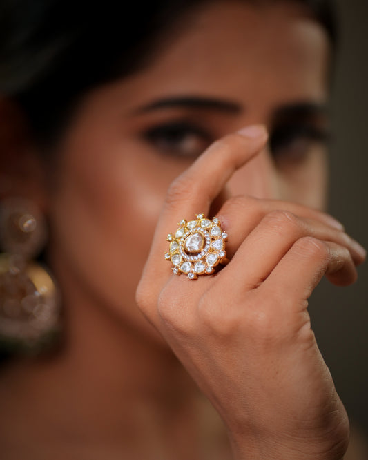 This luxurious Moissanite Polki Ring in 925 Sterling Silver with 22k Gold Plated finish is a perfect blend of royal Indian craftsmanship and modern elegance. Designed with sparkling polki stones and premium moissanite detailing, this adjustable cocktail ring adds timeless beauty to every bridal, festive, and party look. Inspired by traditional Jaipur jewellery artistry, this handcrafted statement ring reflects the grandeur of royal heritage jewellery while offering the comfort of contemporary fashion jewell