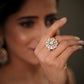 The floral design and gold plated finish create a rich bridal glamour look, making it ideal for weddings, receptions, engagement parties, festive occasions, and ethnic wear styling. Whether paired with sarees, lehengas, salwar suits, or fusion outfits, this designer silver ring enhances every outfit with elegance and luxury. Perfect as a bridal cocktail ring, wedding jewellery accessory, anniversary gift, gift for wife, gift for girlfriend, or festive jewellery piece, this premium adjustable ring is crafted