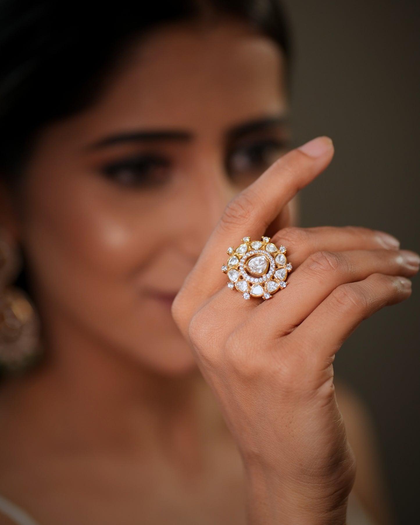 The floral design and gold plated finish create a rich bridal glamour look, making it ideal for weddings, receptions, engagement parties, festive occasions, and ethnic wear styling. Whether paired with sarees, lehengas, salwar suits, or fusion outfits, this designer silver ring enhances every outfit with elegance and luxury. Perfect as a bridal cocktail ring, wedding jewellery accessory, anniversary gift, gift for wife, gift for girlfriend, or festive jewellery piece, this premium adjustable ring is crafted
