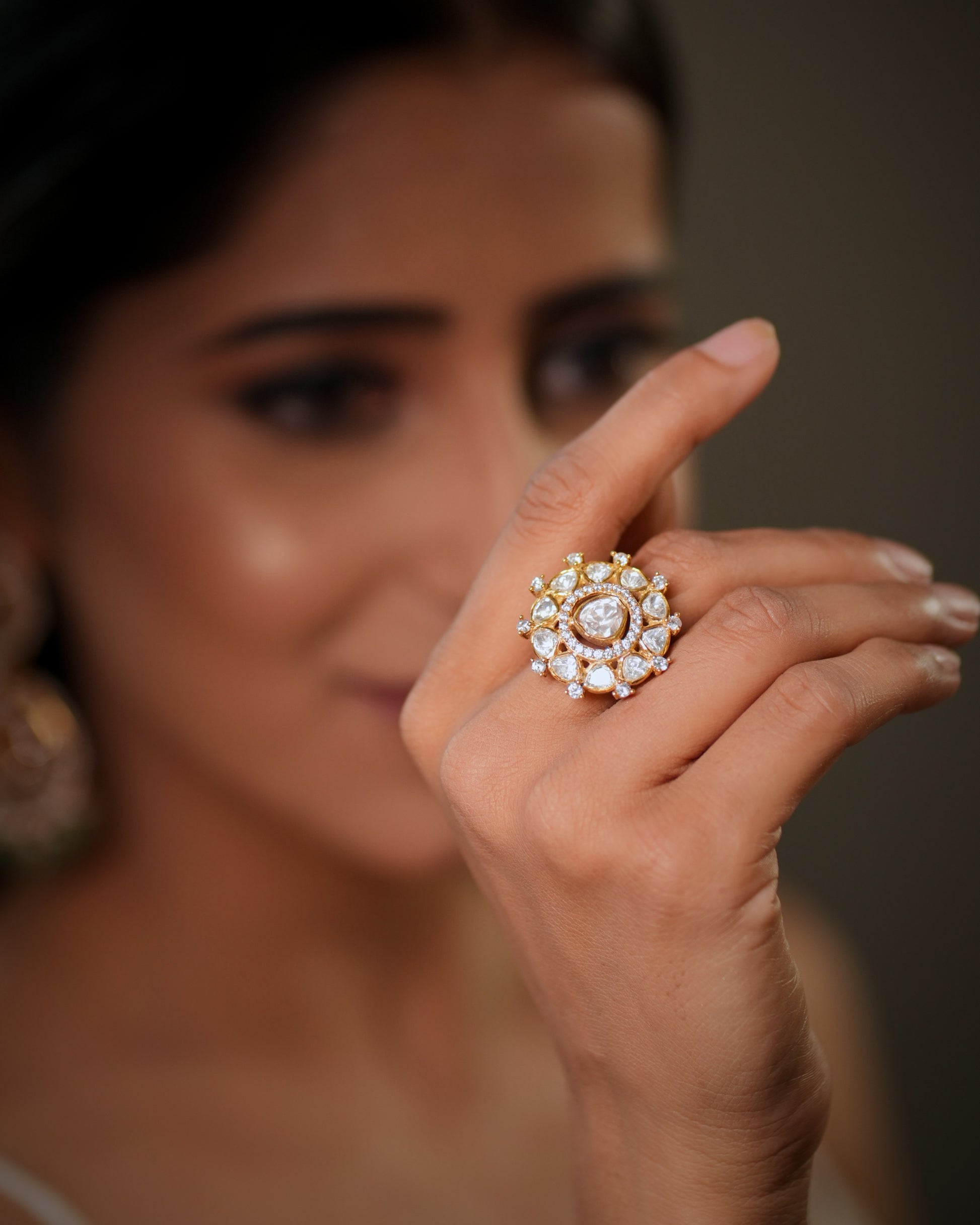The floral design and gold plated finish create a rich bridal glamour look, making it ideal for weddings, receptions, engagement parties, festive occasions, and ethnic wear styling. Whether paired with sarees, lehengas, salwar suits, or fusion outfits, this designer silver ring enhances every outfit with elegance and luxury. Perfect as a bridal cocktail ring, wedding jewellery accessory, anniversary gift, gift for wife, gift for girlfriend, or festive jewellery piece, this premium adjustable ring is crafted