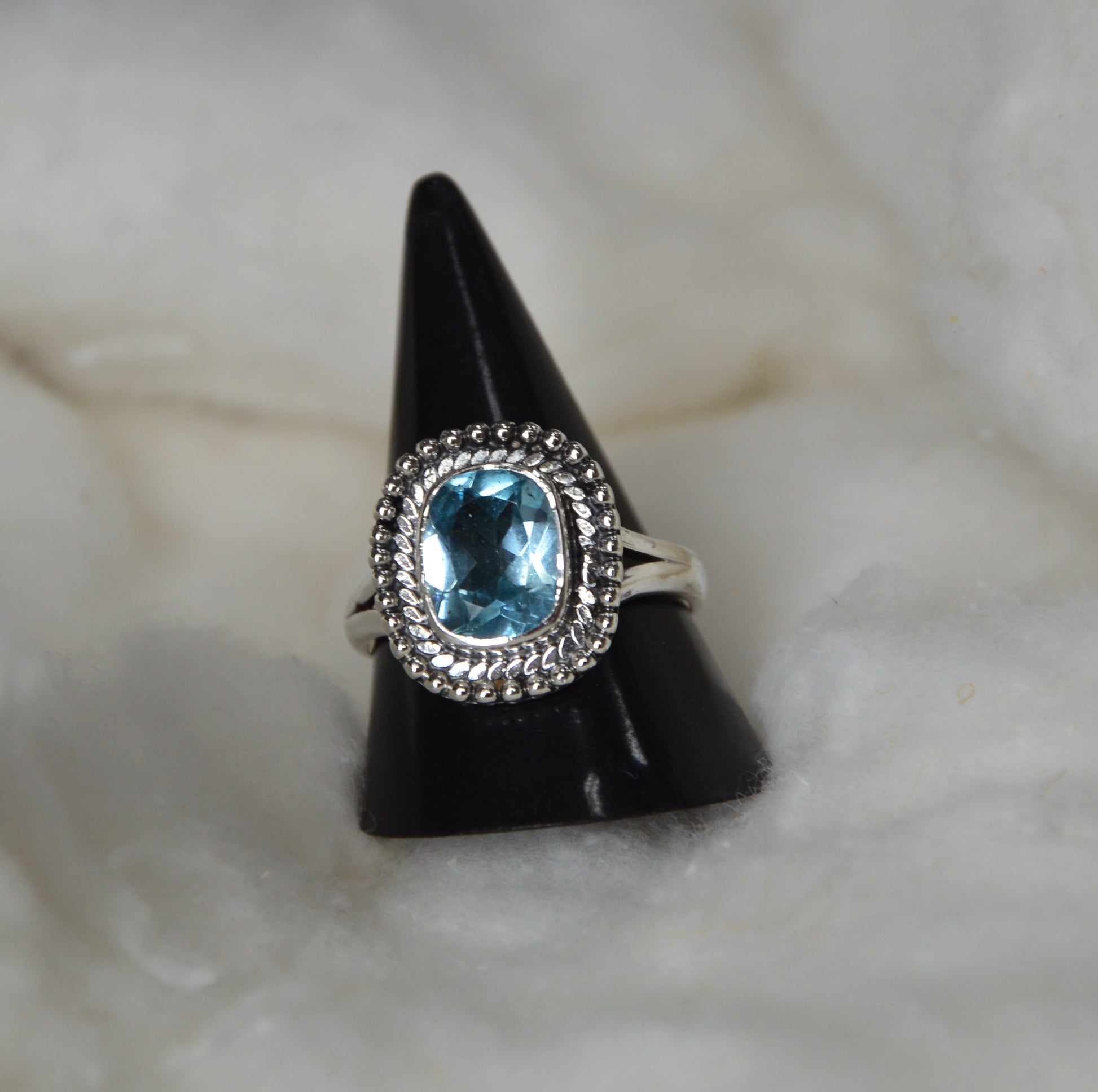 Blue Topaz Ring in 925 Sterling Silver with antique black oxidized polish for a timeless vintage look.
Handcrafted blue topaz gemstone ring in sterling silver, made by Jaipur artisans.
A bold unisex silver ring featuring natural blue topaz and oxidized polish finish.
Cushion-cut real blue topaz set in handcrafted oxidized silver — perfect for spiritual wear.
Shop authentic 925 silver rings with genuine blue topaz from Jaipur jewelry manufacturers.
Luxury meets bohemian style with this black-polished sterlin