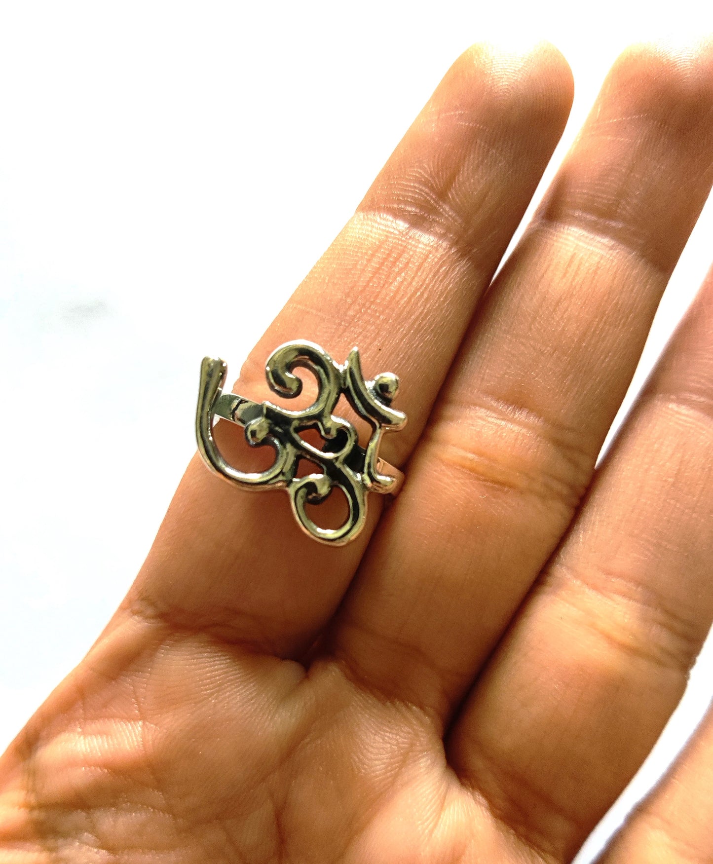 The significance of the Om symbol extends beyond its aesthetic appeal. Known by various names such as Aum, Pranava, Ekakshara, Shabda Brahman, and Omkara, it represents universal energy, divine knowledge, and the interconnectedness of all life. Wearing this symbol serves as a constant reminder of inner peace and the importance of mindfulness in everyday life.