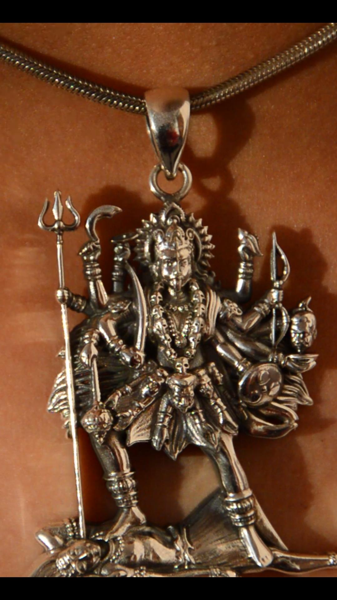 Maa Kali is one of the most revered and powerful deities in Hinduism. She represents the divine feminine force, known as Shakti, and is considered the destroyer of evil and ignorance. She is the fierce form of Goddess Durga and the first among the Dasa Mahavidyas, the ten wisdom goddesses. Her iconic imagery includes a garland of skulls, a protruding tongue, and weapons symbolizing destruction of negativity and protection of righteousness. Her form is both terrifying and compassionate, reflecting her role a