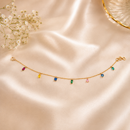 Multi Colour Stone Dainty Chain Bracelet crafted in 925 sterling silver for modern women.
Elegant rainbow gemstone bracelet available in silver plating and 18k gold plated finish.
Minimalist chain bracelet designed for daily wear and luxury styling.
Handcrafted sterling silver bracelet inspired by modern Jaipur jewellery artistry.
Delicate gemstone bracelet perfect for everyday elegance and feminine fashion.