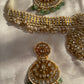 Meenakari work, or minakari, is not only decorative but also carries spiritual significance, representing balance, beauty, and divine connection. Every curve and setting in this necklace is a tribute to Indian jewelry traditions that honor both the inner and outer beauty of a woman.

Wearing this Polki necklace with pearls and emeralds is an experience in itself. It uplifts the entire appearance with elegance, power, and traditional charm. Pair it with a Kanjeevaram saree, Banarasi silk, or a heavy embroide
