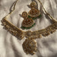 This Polki Necklace Set with Pearl and Emeralds is a luxurious example of traditional Indian jewelry, crafted in the sacred and timeless art of Kundan Meena and Meenakari work. Made in pure 925 sterling silver with a rich 22k gold plating, this handcrafted piece reflects the royal heritage of Jaipur, Rajasthan. The necklace features brilliant Polki stones and imitation emeralds, combined with delicate pearls that enhance its divine beauty