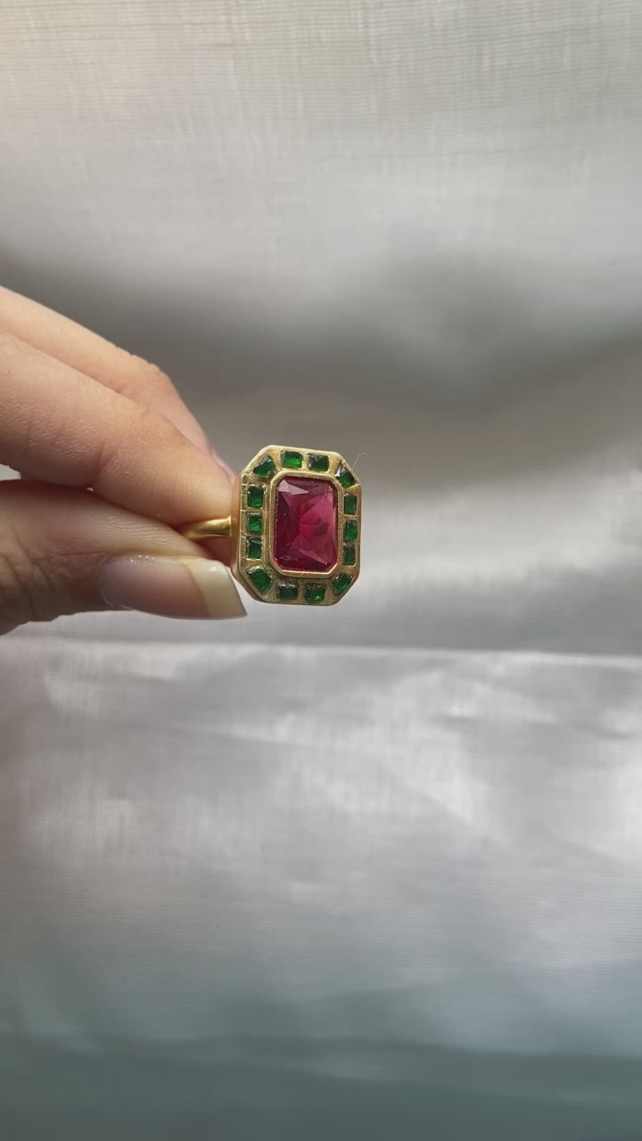 Whether you are buying this gold-plated silver ring for yourself or as a gift for a loved one, it holds not just emotional value but also financial worth. Over time, your investment in this sterling silver jewelry can appreciate, making it a meaningful addition to your collection.

The elegant design of this red and green kundan ring allows versatile styling. Pair it effortlessly with lehengas, bridal sarees, Anarkali suits, or even Indo-western outfits.